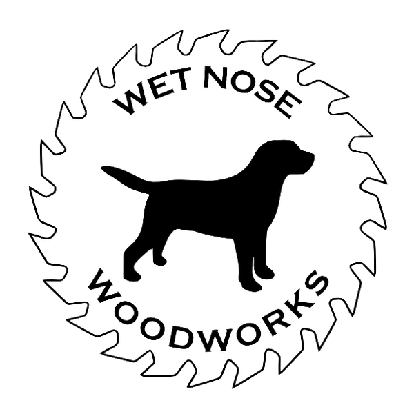 Logo for Wet Nose Woodworks featuring a silhouette of a dog inside a circular saw blade outline. The company name arcs along the inside edge of the blade.