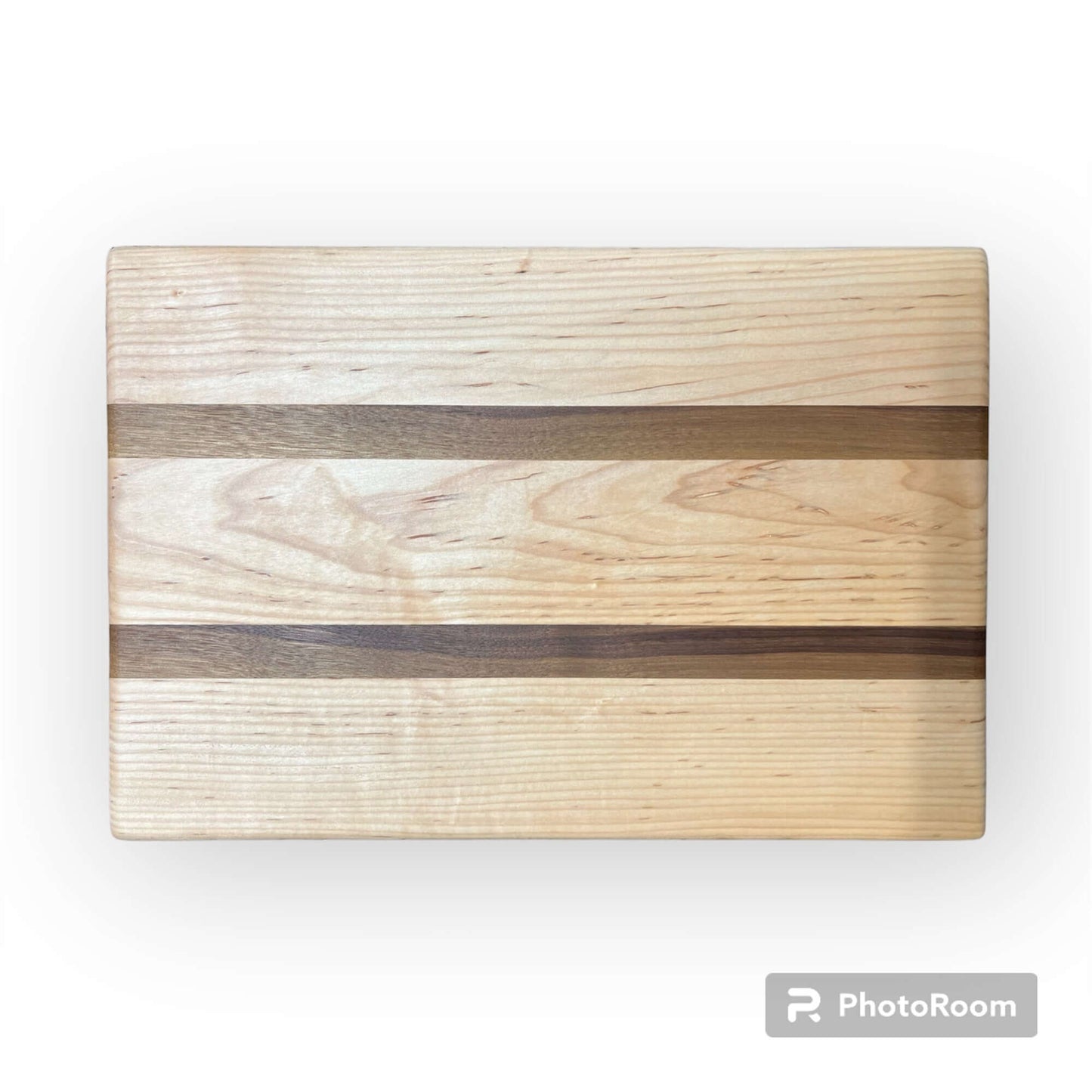 Three Wet Nose Woodworks Walnut and Maple Racing Stripe Cutting Boards are arranged on a white background, featuring alternating light and dark wood stripes. The largest board is on top, with two smaller boards below.