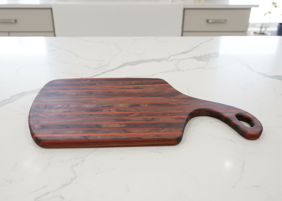 Handcrafted cutting boards made from walnut, maple, cherry, padauk, and sapele by Wet Nose Woodworks
