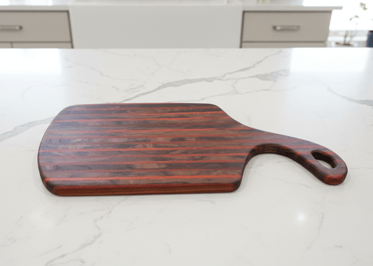 Handcrafted cutting boards made from walnut, maple, cherry, padauk, and sapele by Wet Nose Woodworks