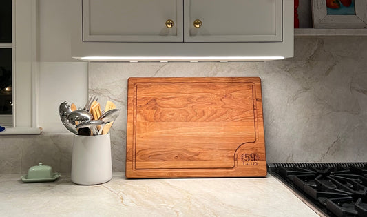 Oiling a handmade hardwood cutting board with food-grade mineral oil