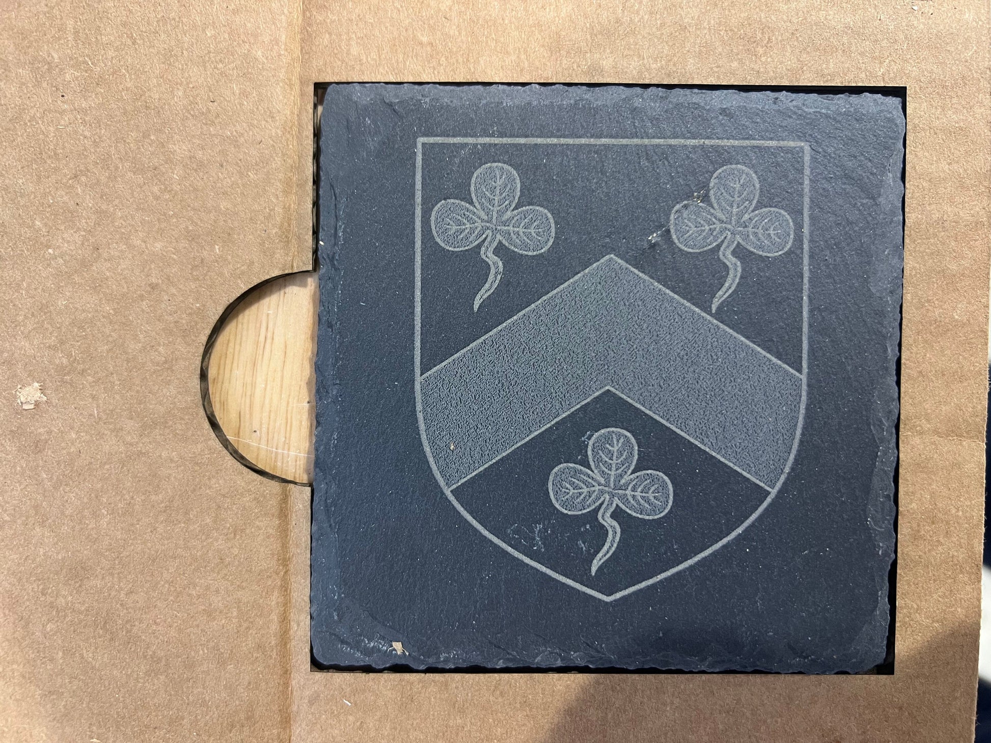 The 4 inch Square Black Slate Coaster Laser Engraving Alignment Jig Template Holder by Wet Nose Woodworks features six square cutouts for perfect coaster alignment. Includes SVG and Lightburn files for xTool and other laser cutters.