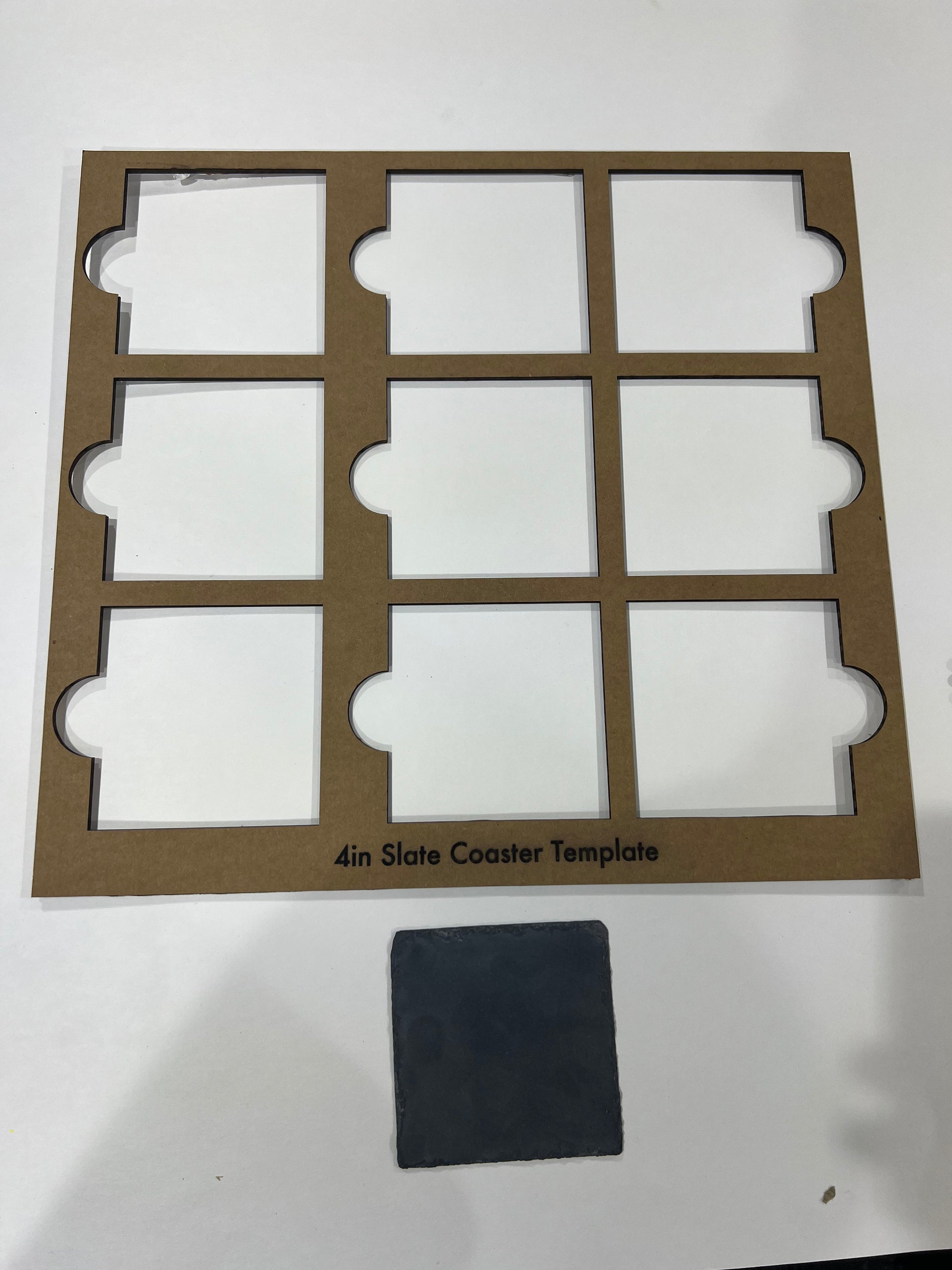A collage displays circular and square 4-inch black slate coaster jigs by Wet Nose Woodworks, featuring SVG files for laser engraving, with “Black Slate Coasters Alignment Jig Bundle Pack Digital Files” across the center.