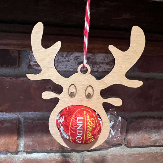 The Wet Nose Woodworks Digital Ornament Templates include a reindeer Lindt Lindor chocolate holder—perfect for festive designs. This laser-ready SVG/Lightburn file set features gingerbread man, snowflake, and reindeer ornaments.
