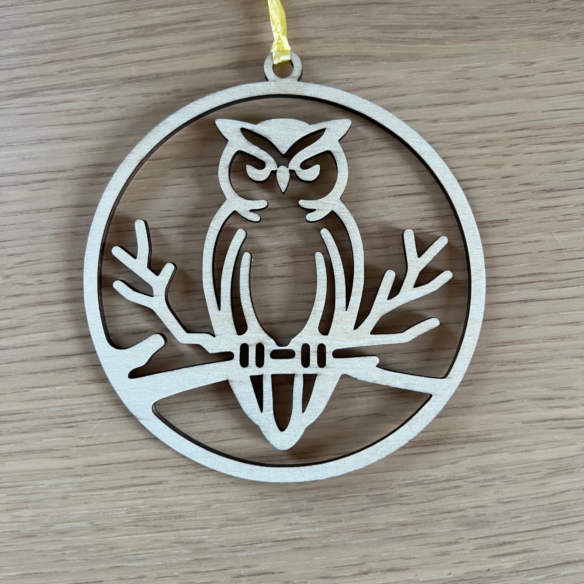 The Digital Owl Ornament and Inspirational Card Template by Wet Nose Woodworks features a wood owl with yellow ribbon on a poem titled The Owl—an ideal inspirational gift for teachers or mentors. Includes SVG/PDF laser cut files, xTool compatible.