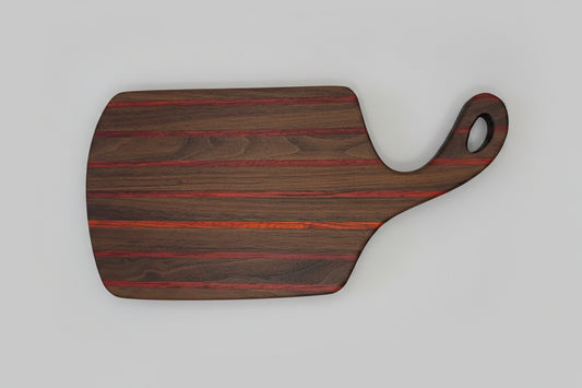 Wooden cutting board with a handle on a white towel