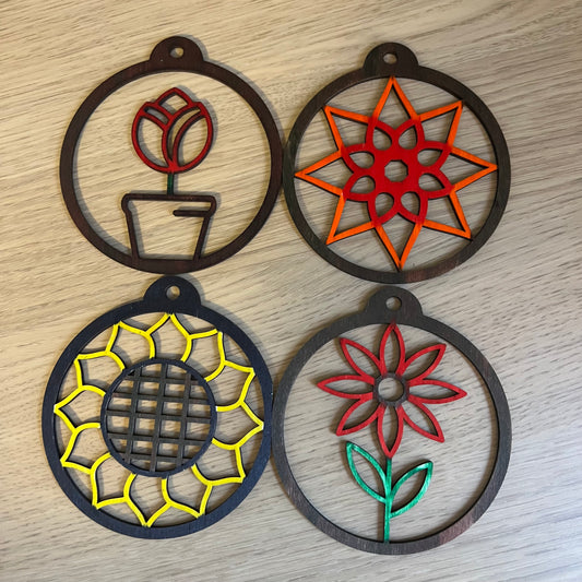 The Floral SVG Bundle by Wet Nose Woodworks features laser-ready Sunflower, Tulip, Daisy & Swirl designs—ideal for unique spring decor or showcasing floral art with xTool, LightBurn, or Glowforge digital downloads.