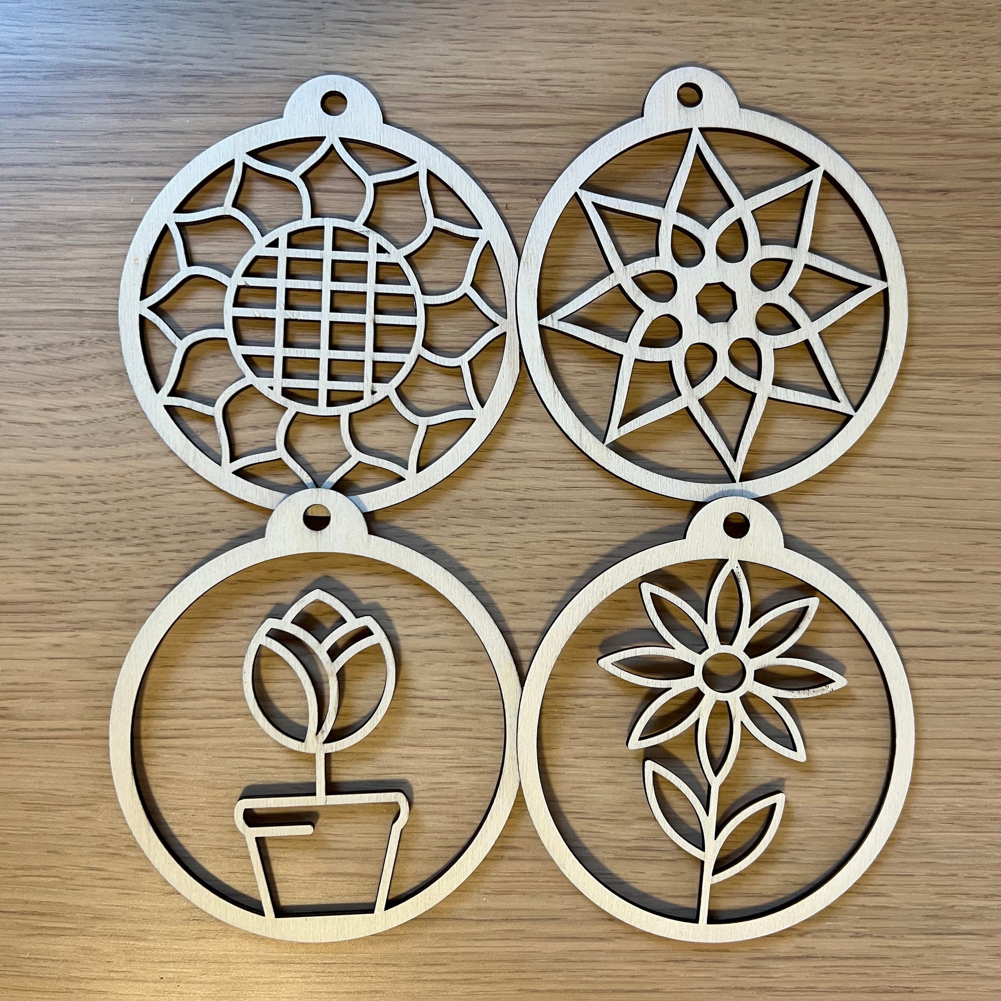 The Floral SVG Bundle by Wet Nose Woodworks features laser-ready Sunflower, Tulip, Daisy & Swirl designs—ideal for unique spring decor or showcasing floral art with xTool, LightBurn, or Glowforge digital downloads.