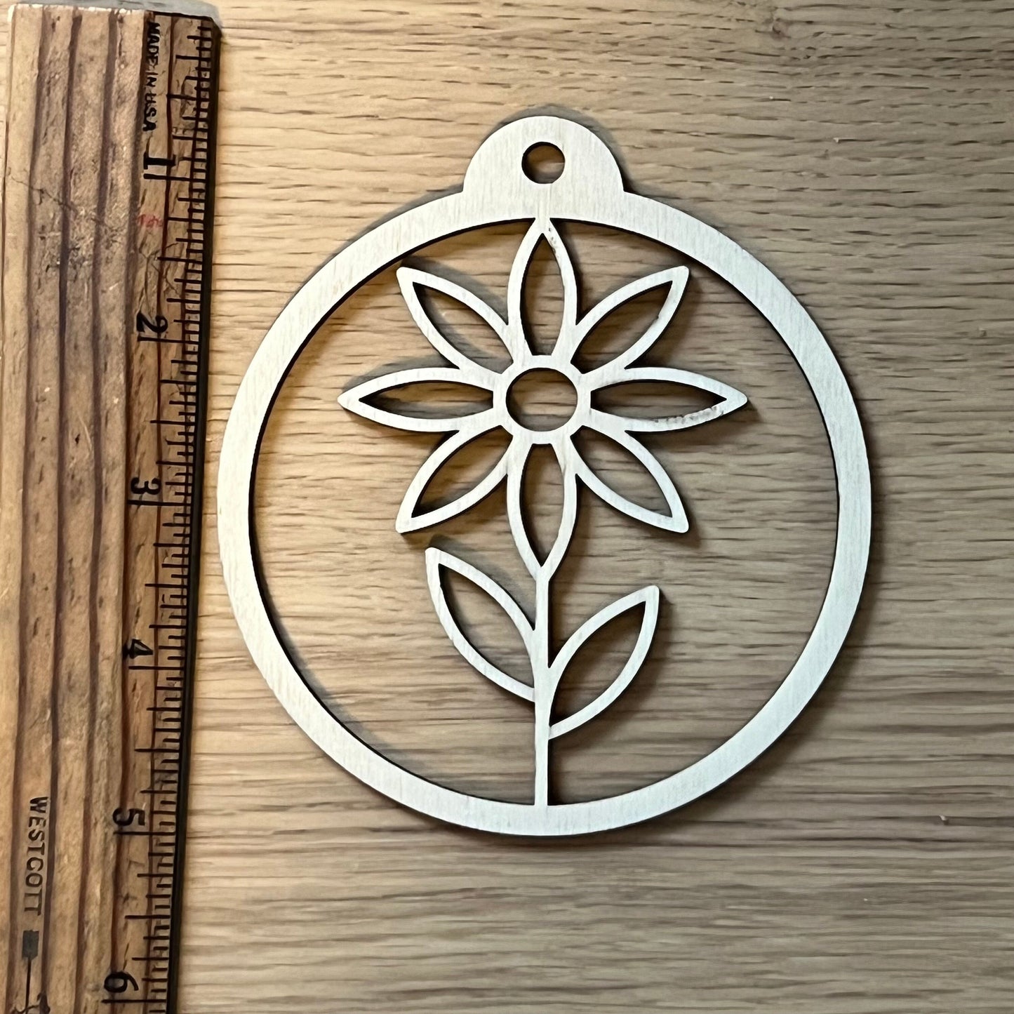 The Floral SVG Bundle by Wet Nose Woodworks features laser-ready Sunflower, Tulip, Daisy & Swirl designs—ideal for unique spring decor or showcasing floral art with xTool, LightBurn, or Glowforge digital downloads.