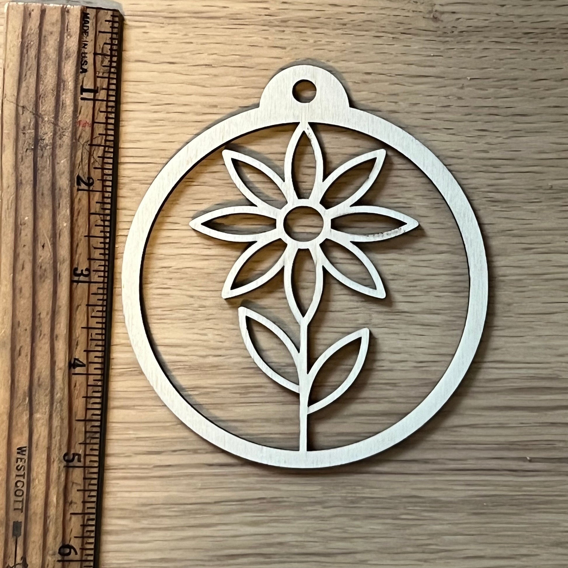 The Floral SVG Bundle by Wet Nose Woodworks features laser-ready Sunflower, Tulip, Daisy & Swirl designs—ideal for unique spring decor or showcasing floral art with xTool, LightBurn, or Glowforge digital downloads.