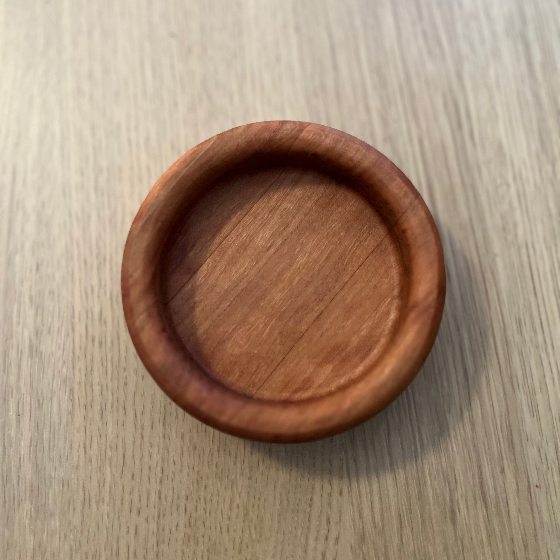 Wooden coaster on a wooden surface