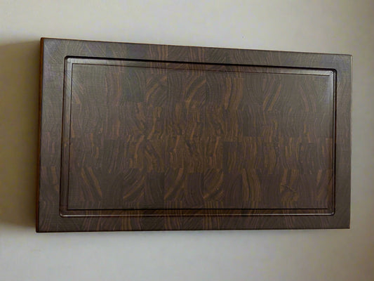 Wooden Walnut cutting board on a white background