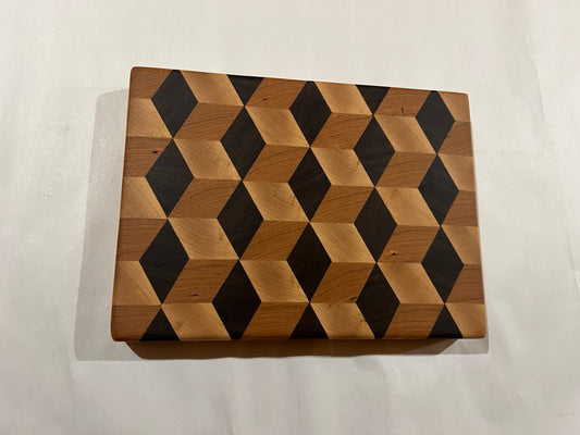 Wooden cutting board with geometric pattern on a white background