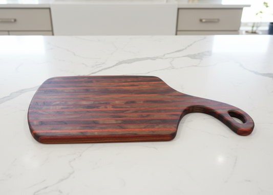 Wooden cutting board on a marble countertop