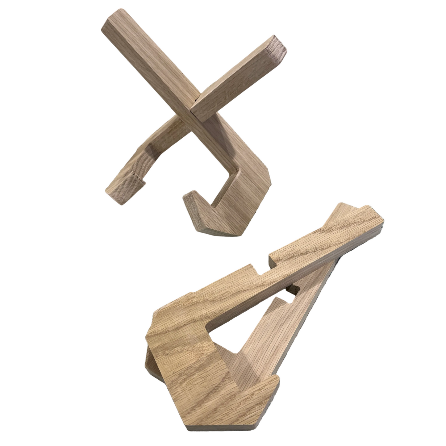 Wooden cutting board stand pieces on a textured surface