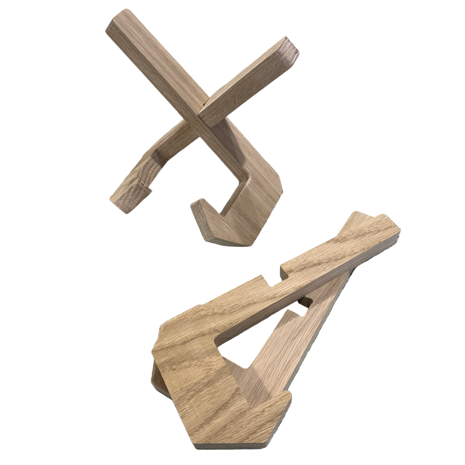 Wooden cutting board stand pieces on a textured surface