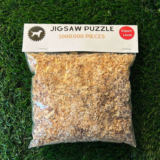 The Impossible Jigsaw Puzzle by Wet Nose Woodworks is a bag of wood shavings labeled “1,000,000 Pieces, Expert Level,” making for a hilarious challenge that will stump even serious puzzle fans.