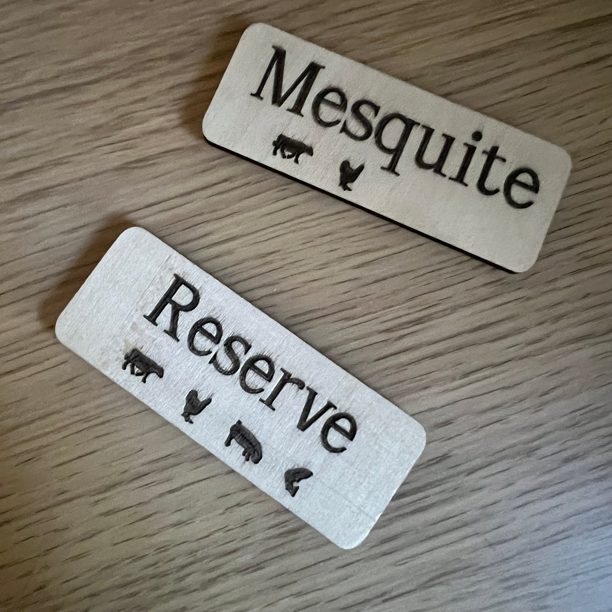 A collage displays Wet Nose Woodworks Laser Cut File: Smoker Grill Wood Pellet Label Magnets—Mesquite and Reserve—plus black-and-white SVG design templates, a Reserve label on a grill, and Lightburn/xTool file icons.