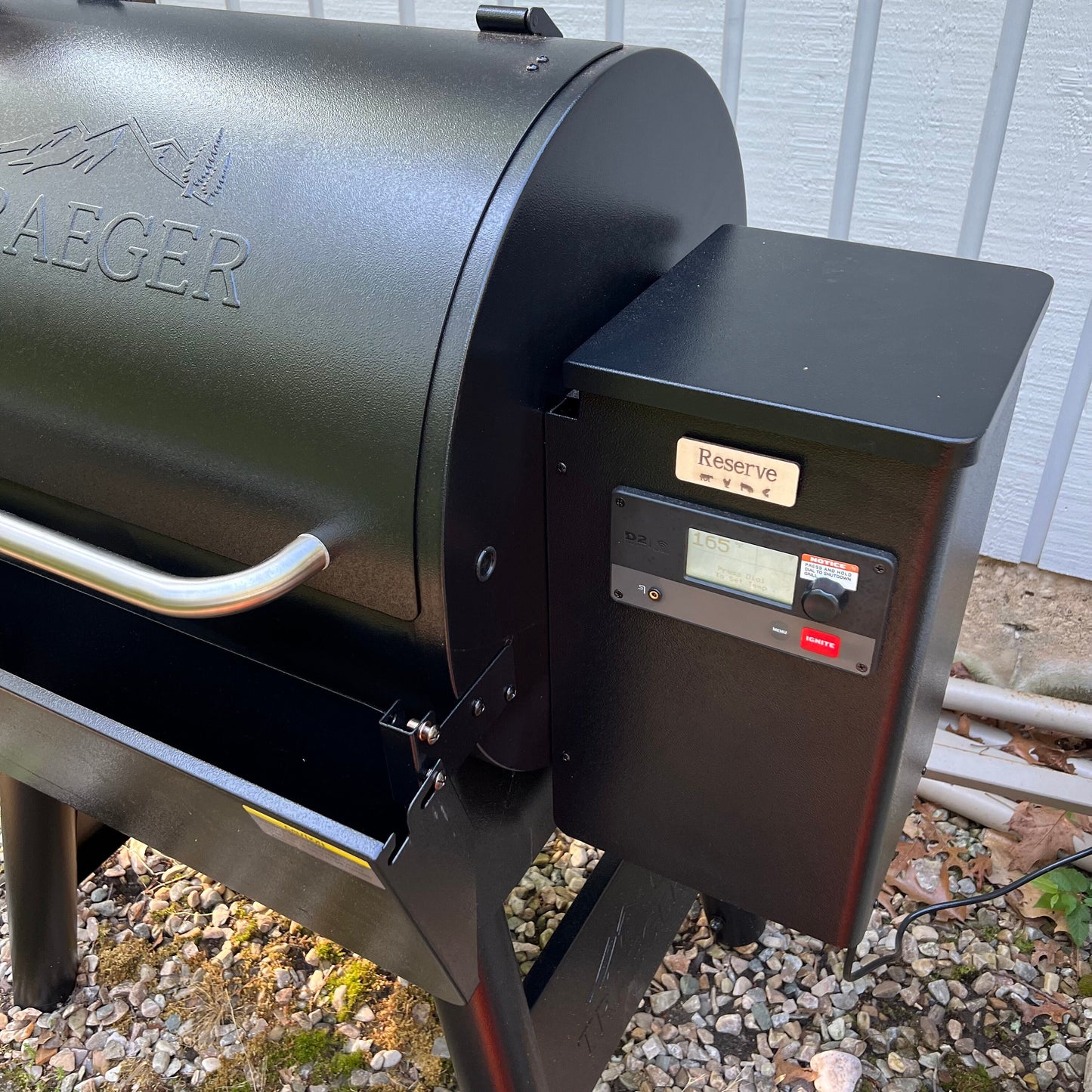 A collage displays Wet Nose Woodworks Laser Cut File: Smoker Grill Wood Pellet Label Magnets—Mesquite and Reserve—plus black-and-white SVG design templates, a Reserve label on a grill, and Lightburn/xTool file icons.