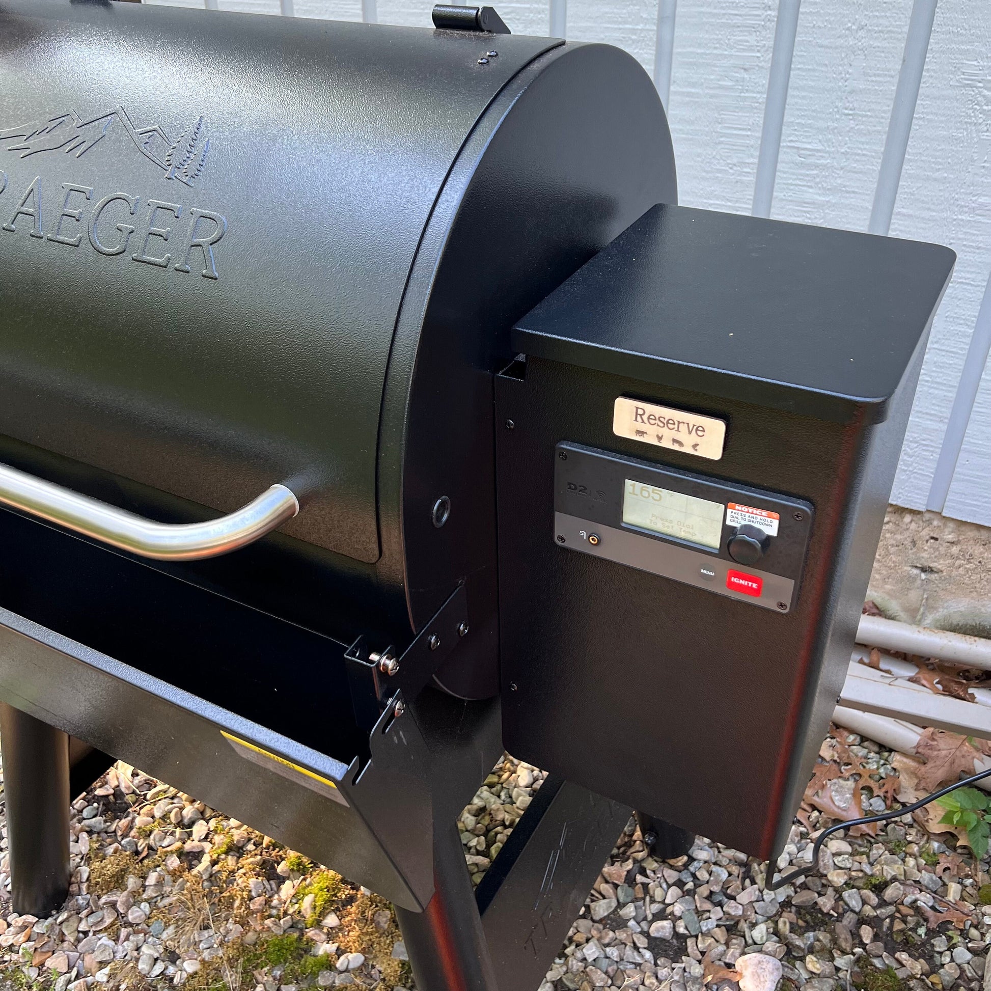 A collage displays Wet Nose Woodworks Laser Cut File: Smoker Grill Wood Pellet Label Magnets—Mesquite and Reserve—plus black-and-white SVG design templates, a Reserve label on a grill, and Lightburn/xTool file icons.