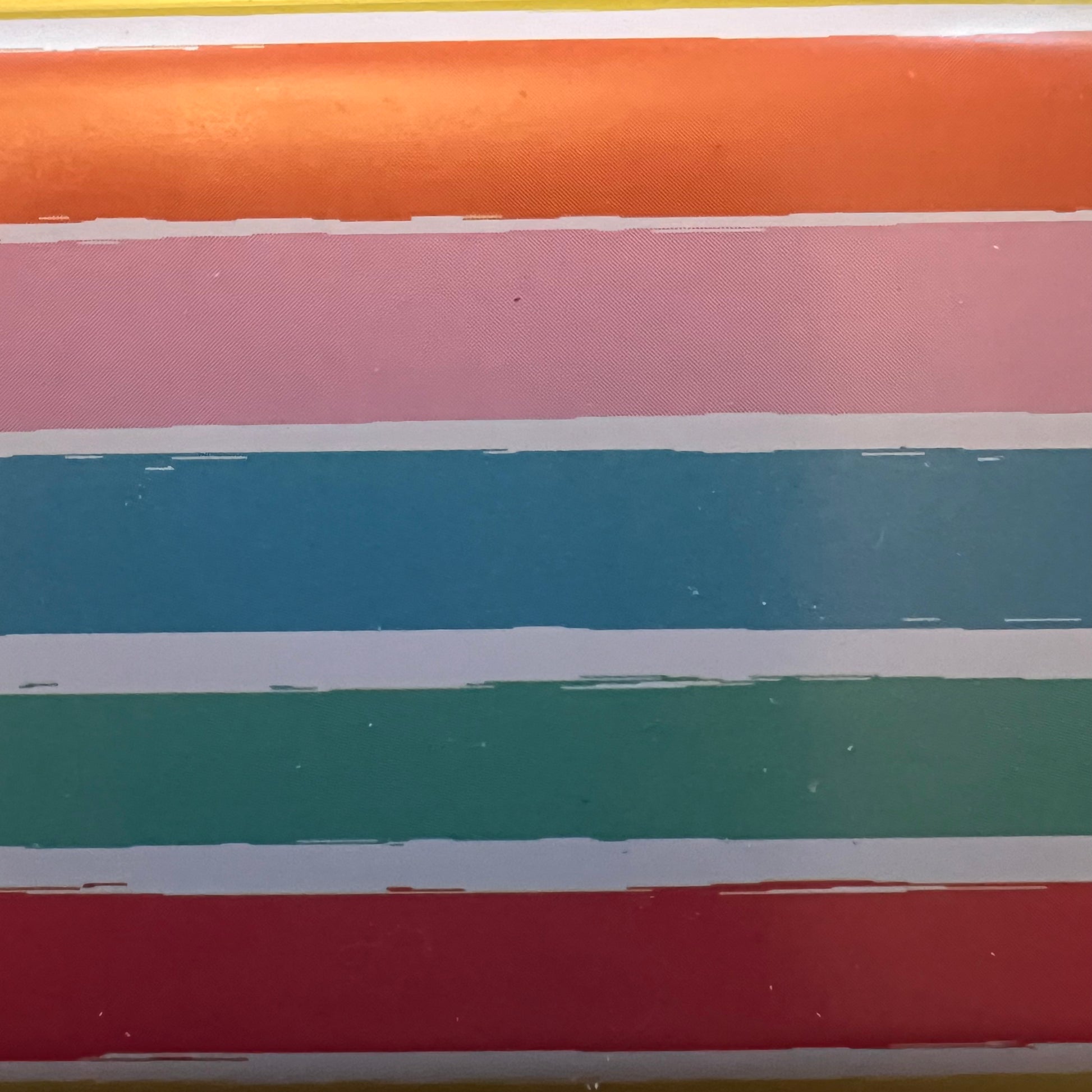 Wet Nose Woodworks Metal Pencil Boxes come in four colorful designs—Kaylea (animal print), Celia (striped), Grace (rainbows & crowns), and Tommy (dinosaurs)—with snap closures, keeping desks stylish and organized.