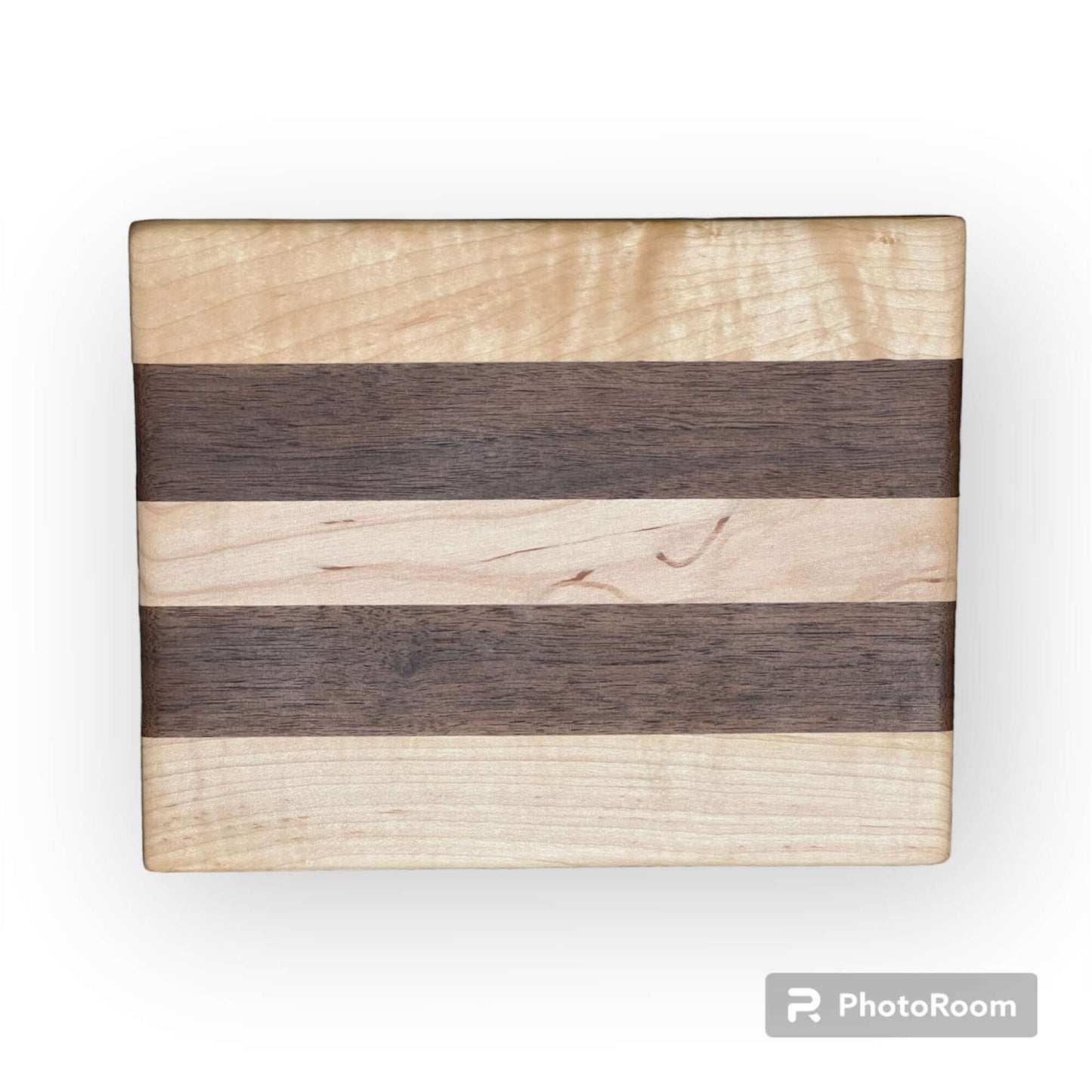 Three Wet Nose Woodworks Walnut and Maple Racing Stripe Cutting Boards are arranged on a white background, featuring alternating light and dark wood stripes. The largest board is on top, with two smaller boards below.